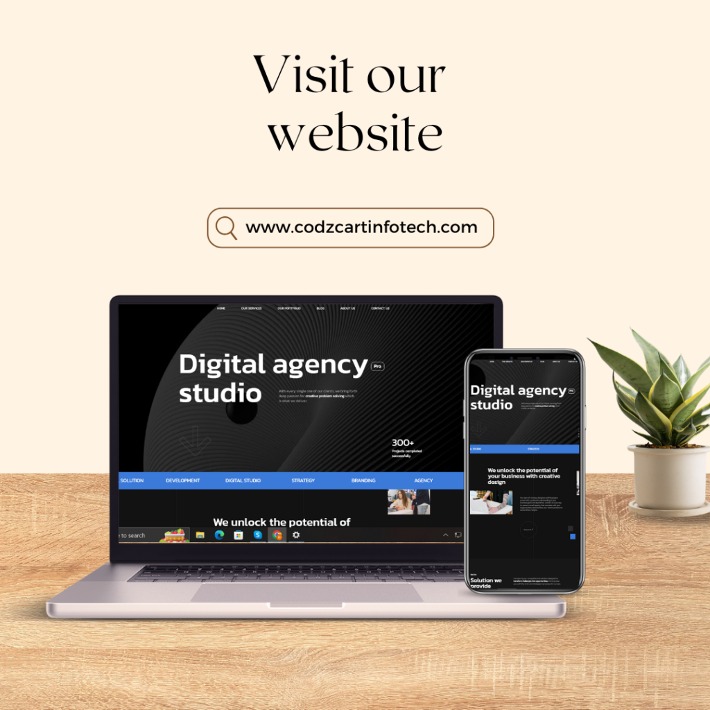 "Visit our website" is written at the top, encouraging viewers to check out the site www.codzcartinfotech.com. Below this text, there is a sleek digital agency studio website displayed on both a laptop and a smartphone, emphasizing the website's responsive design. The laptop and phone are placed on a wooden surface next to a small potted plant, adding a touch of natural aesthetics to the modern, professional setting.